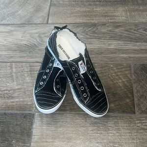 True Religion distressed slip on black & white sneakers.